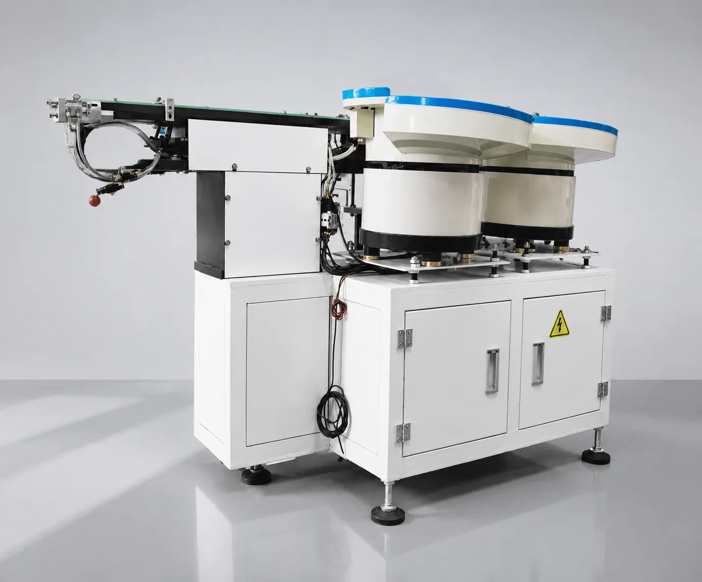 Lens vibratory bowl feeder in continuous production on a TV backlight line