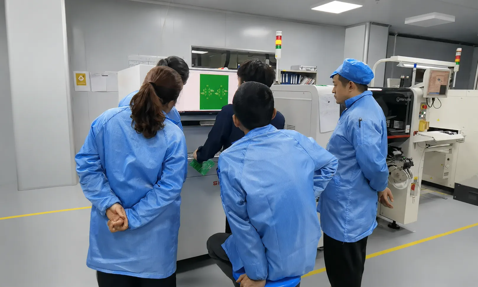 Jinghe engineer training customer operators on SMT machine operation