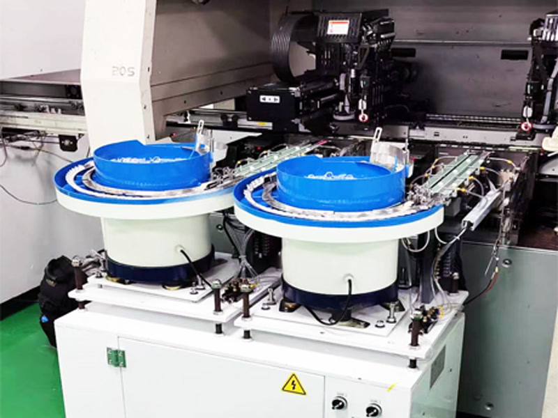 SMT lens feeder feeding TV backlight lenses on a Xiamen production line